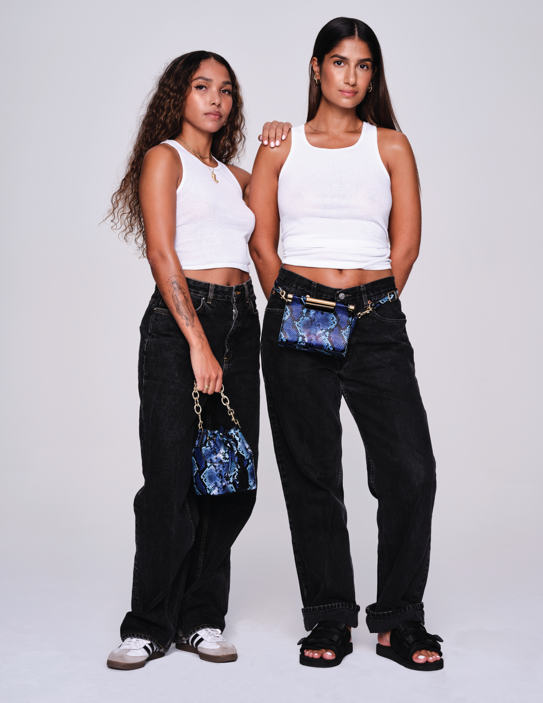 Woman wearing MAX+min Bonnie snakeskin leather crossbody bucket bag