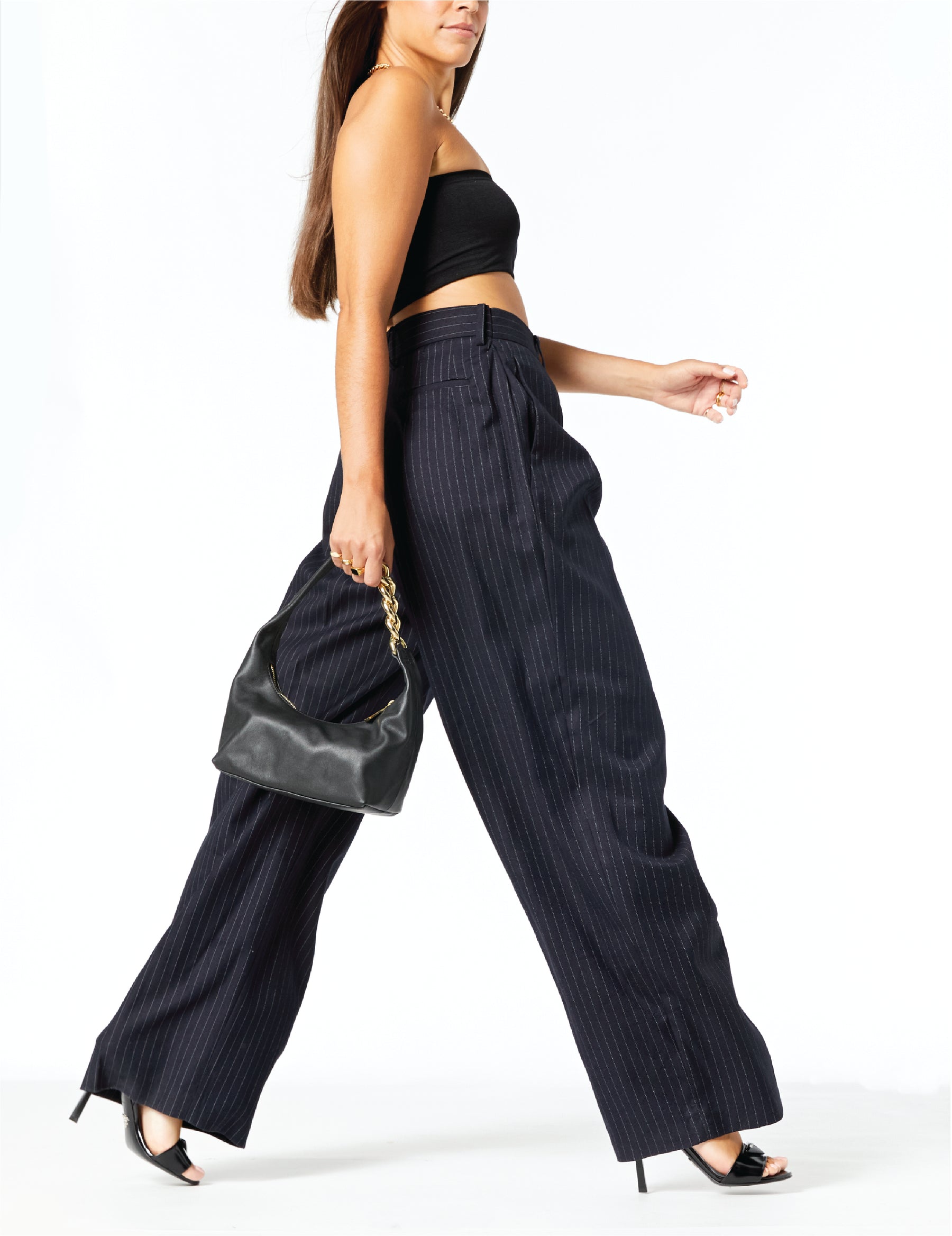 Woman wearing MAX+min Randi Black leather hobo bag